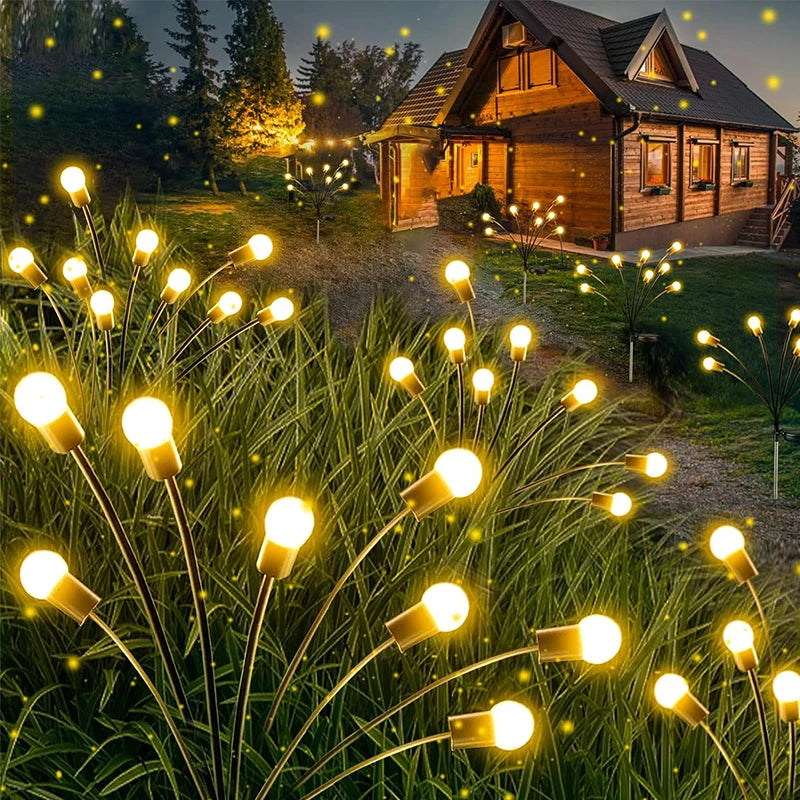 Solar-powered firefly lights swaying in garden
